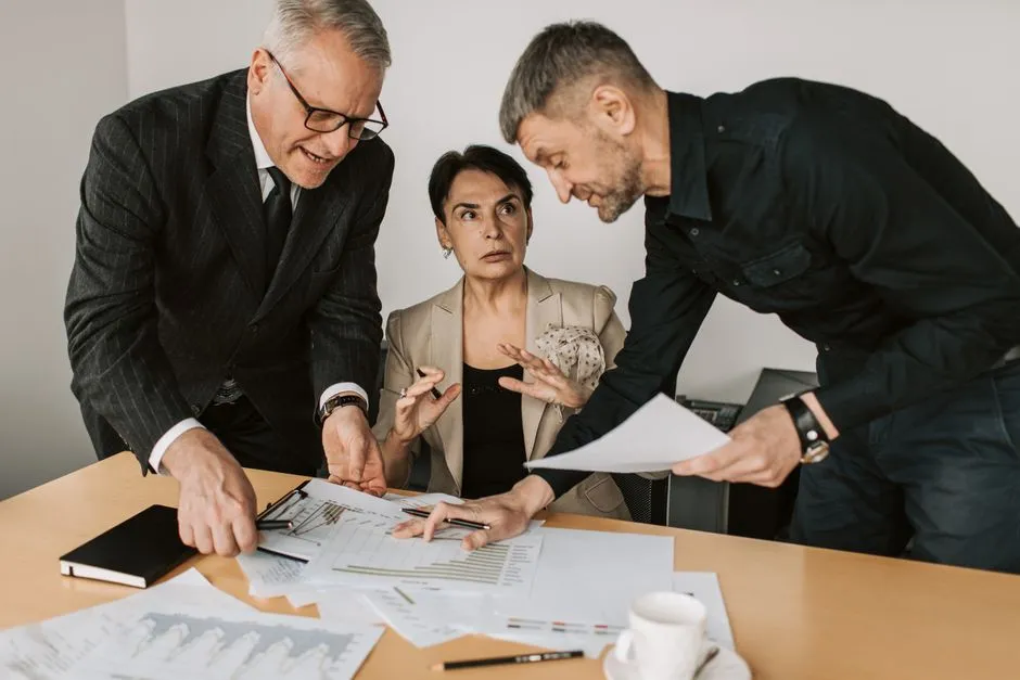 Two colleagues in a discussion during an office meeting